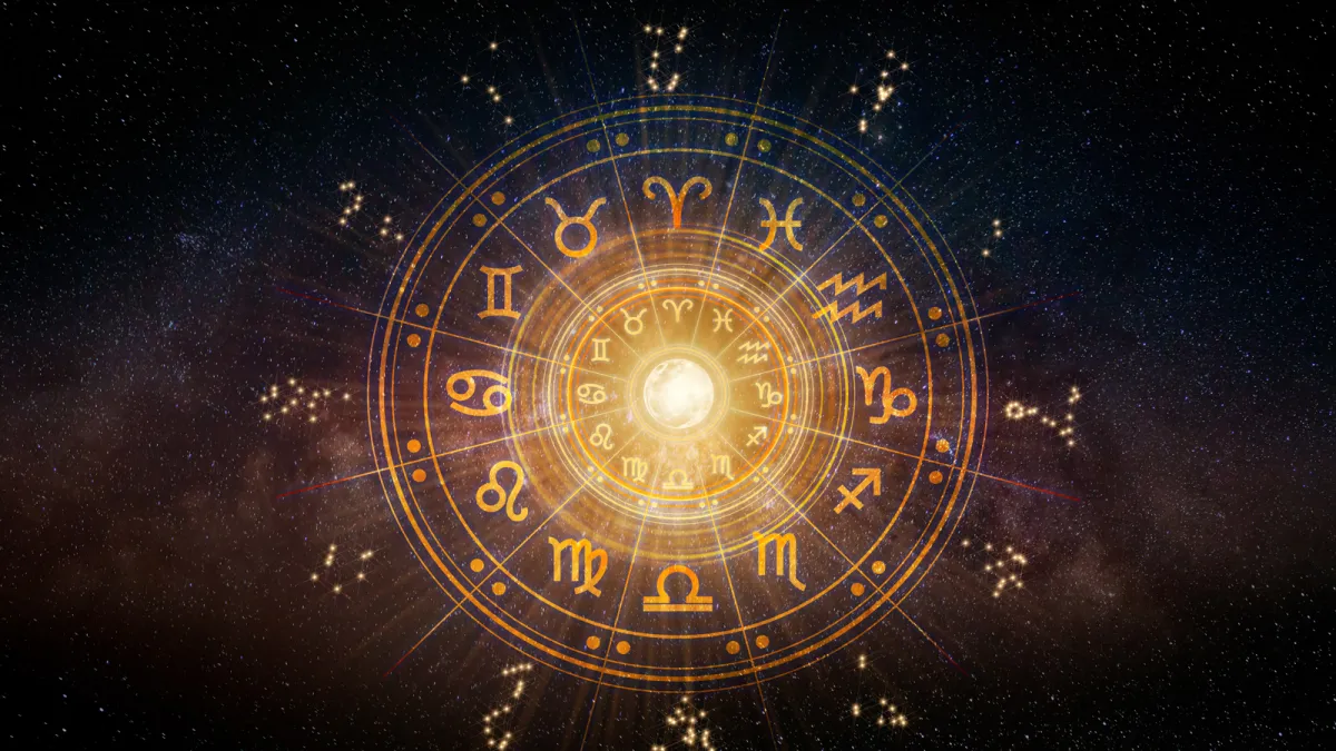 Golden astrological zodiac wheel with all twelve signs against a deep space nebula, used for moon sign calculation